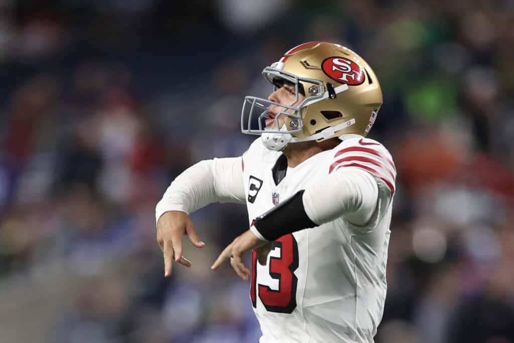 SEATTLE, WASHINGTON - OCTOBER 10: Brock Purdy #13 of the San Francisco 49ers reacts after throwing a pass for a touchdown during the fourth quarter against the Seattle Seahawks at Lumen Field on October 10, 2024 in Seattle, Washington.